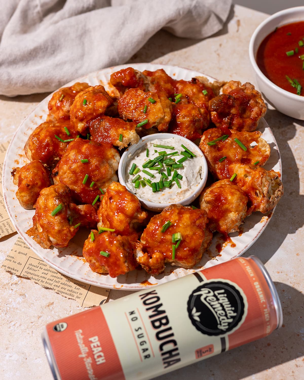 Cauliflower bites, BBQ sauce, and a Liquid Remedy Kombucha