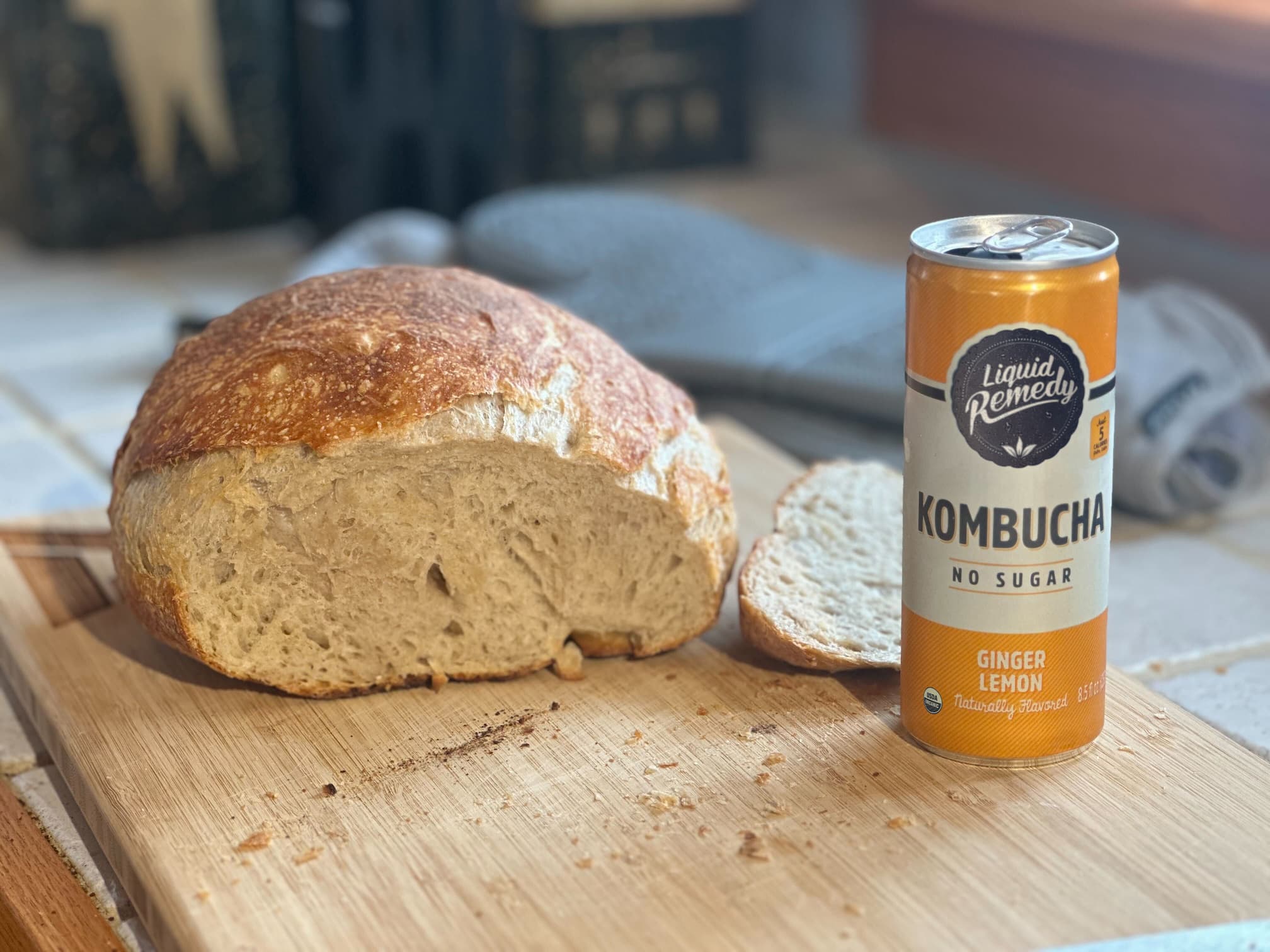 Liquid Remedy Kombucha next to sourdough bread